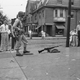A soldier stands guard with an automatic rifle at the carbarn at 49th Street and Woodland Avenue in Philadelphia on Aug. 6, 1944. Troops were stationed on all transit lines today as service was resumed on many lines. (AP Images)